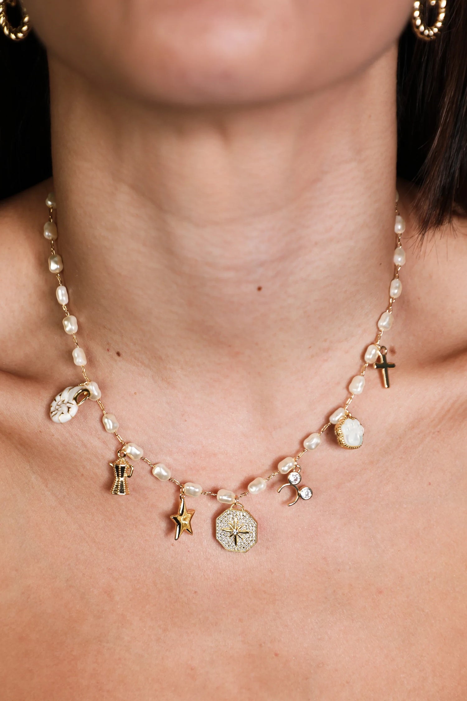 Custom pearl charm necklace hand-assembled at Balboa Gold Costa Mesa — personalized with initials, zodiac, and symbol charms