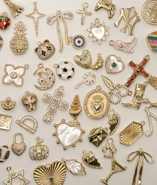 A collection of various charms to build your custom charm bracelet